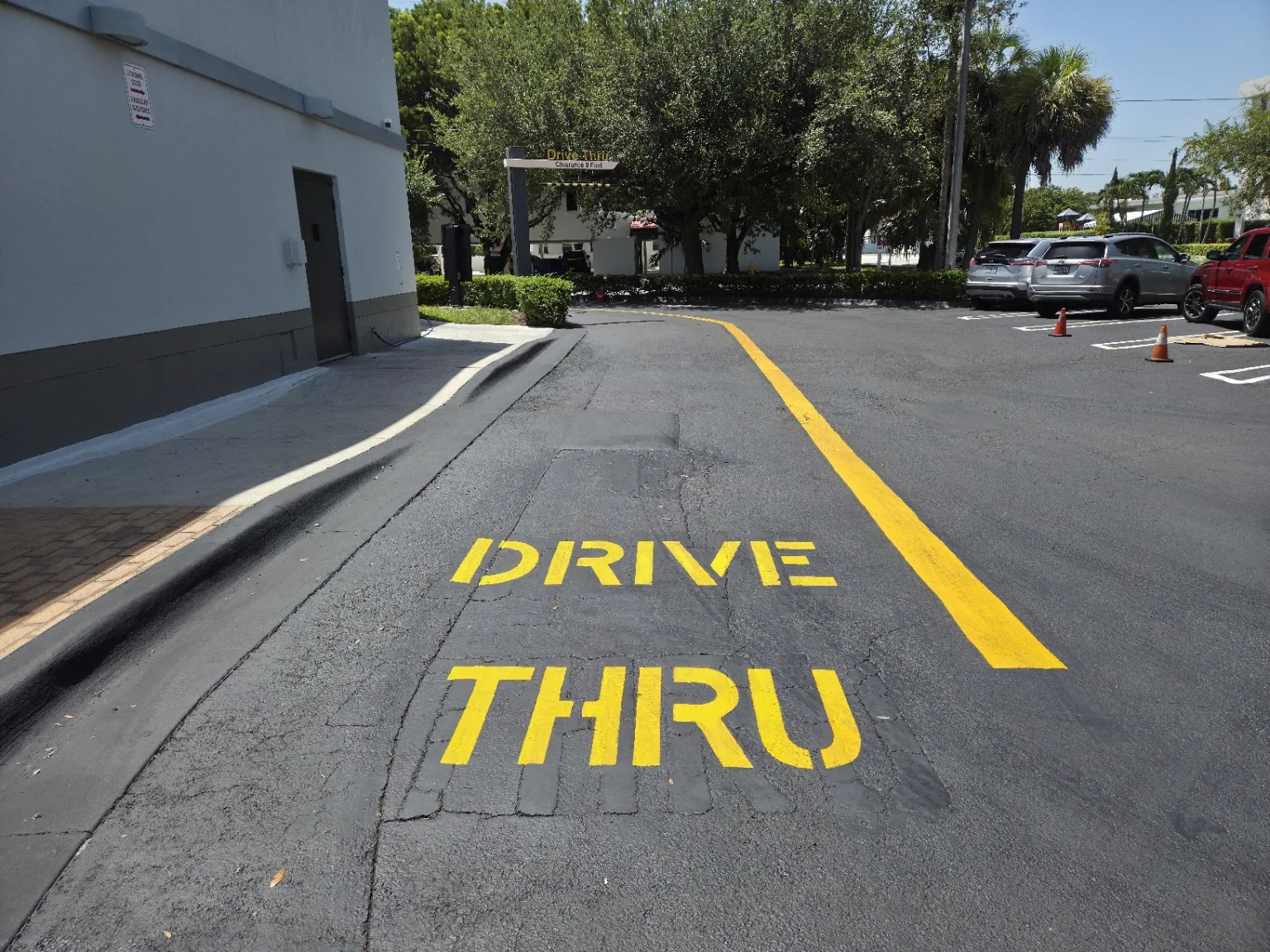 Fresh yellow drive through pavement markings